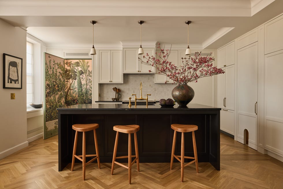 Modern kitchen with an island and decorative elements.