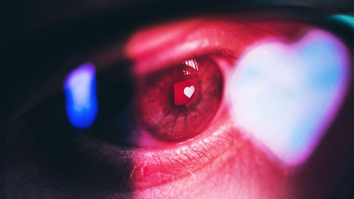 Reflection of a smartphone screen in a person's eye.