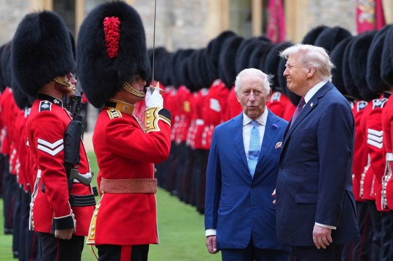  President Donald Trump and Britain's King Charles III review the Guard of Honour after the arrival at Windsor Castle in Windsor, England
