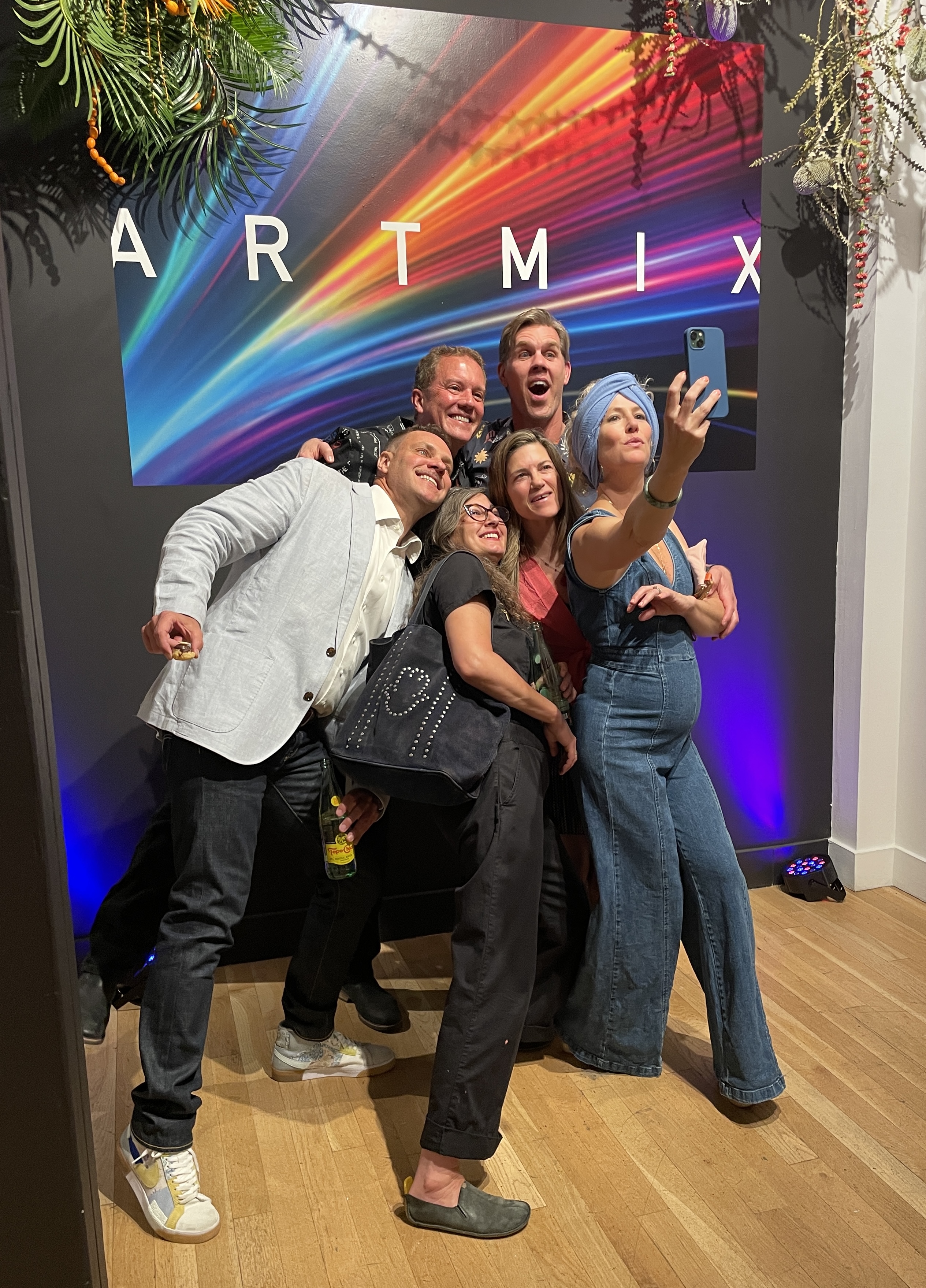Guests pose for a photo during a previous Artmix event...