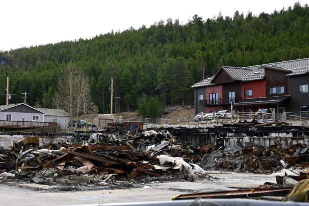 Debris from the 2025 fire is seen at the Caribou Village Shopping Center in Nederland on Tuesday. (Joel Solis/Staff Photographer)
