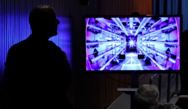 Guests await the beginning of a news conference with U.S. Energy Secretary Jennifer Granholm at the Department of Energy headquarters to announce a breakthrough in fusion research on December 13, 2022 in Washington, DC.