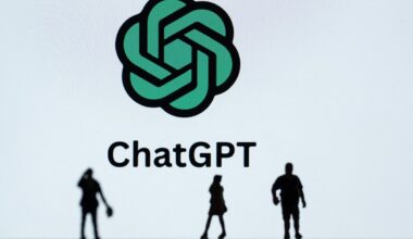 This photograph taken in Mulhouse, eastern France on October 19, 2023, shows figurines next to the ChatGPT logo. (Photo by SEBASTIEN BOZON/AFP via Getty Images)