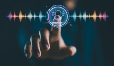Voice recording. Man touching microphone icon on smartphone. Mobile application record sound, audio, music, voice message or use your voice to direct AI to search for information on Internet.