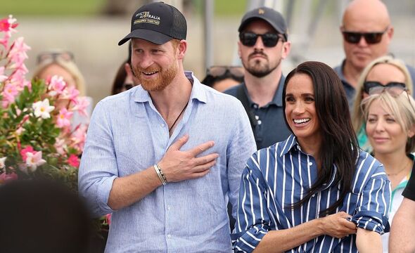 Prince Harry, Duke of Sussex and Meghan, Duchess of Sussex greet members of the public at the Cruising Yacht Club of Australia