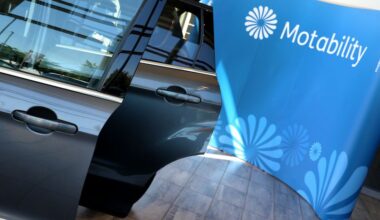 Motability logo beside an open car door