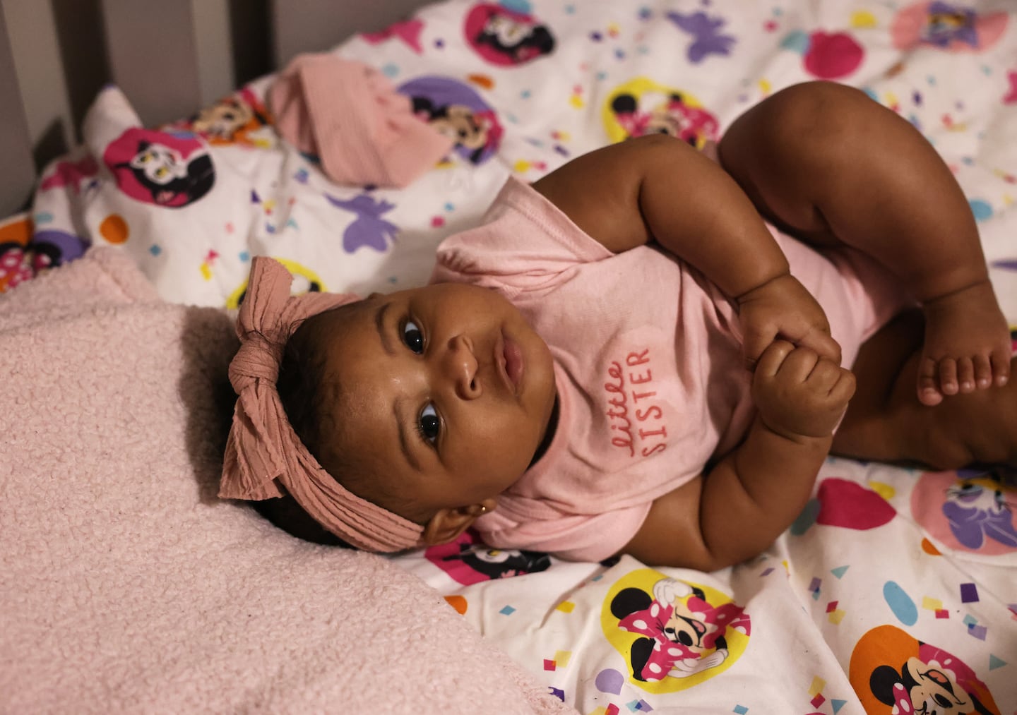 Brianna Smith-Thomson’s daughter Serenity looked up from her crib.