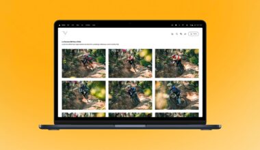 A laptop displays a photo gallery of mountain bikers riding on a rugged forest trail, set against a bright orange background.