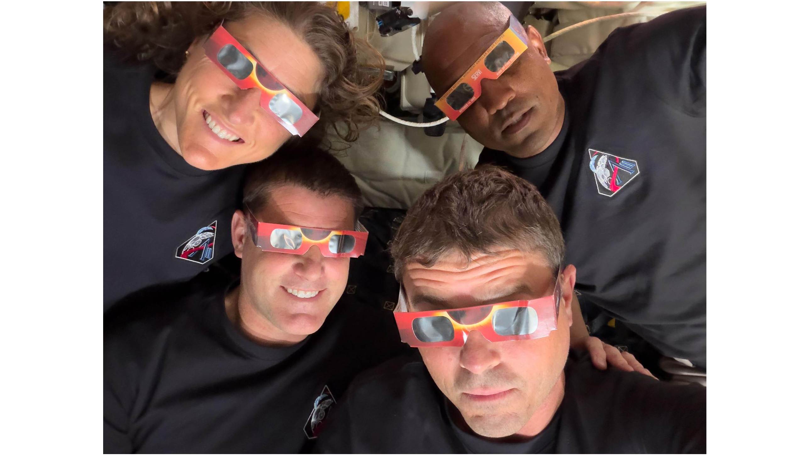 The Artemis 2 astronauts showing off safe solar-eclipse-viewing practices inside their Orion spacecraft on April 6, 2026.