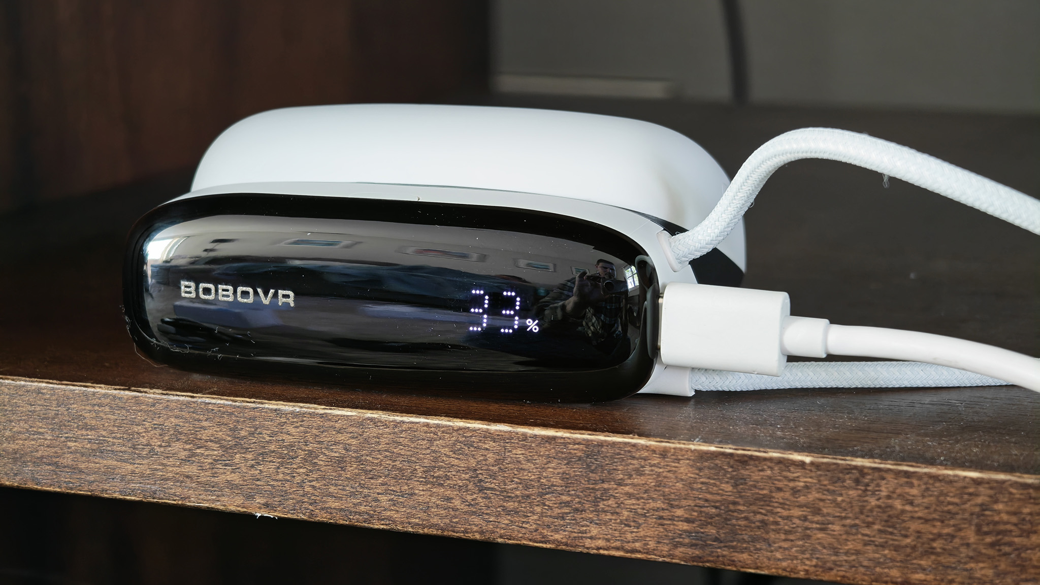 The BoboVR S3 Pro battery dock charging a battery pack