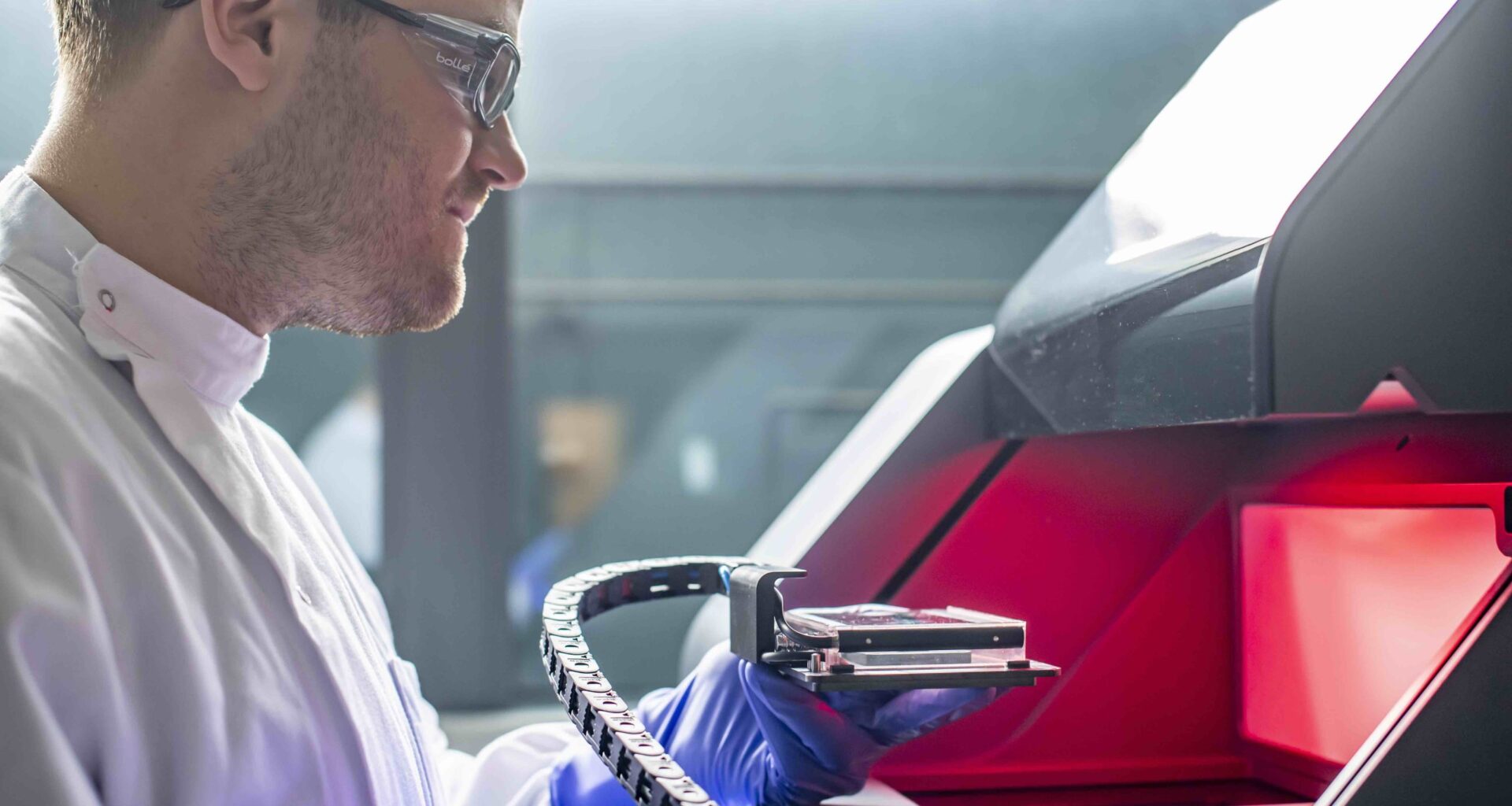 Dr. Robert Owen working with laboratory equipment. Photo via University of Nottingham.