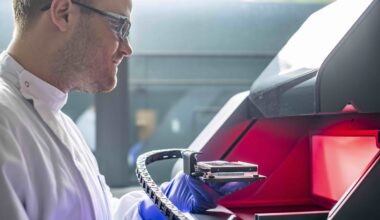 Dr. Robert Owen working with laboratory equipment. Photo via University of Nottingham.