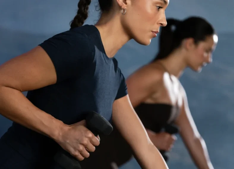 women work out with dumbbells at a Club Pilates