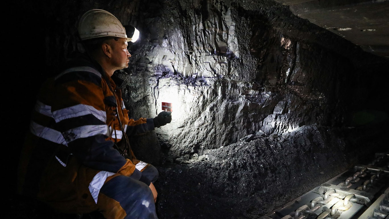 An employee is at work at the Vorkutinskaya mine of VorkutaUgol in the town of Vorkuta, north of the Arctic Circle. Mikhail Klimentyev / TASS