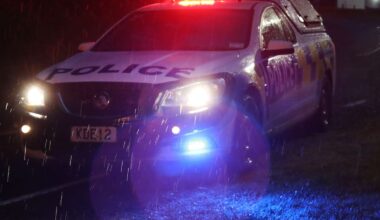 Car drives into floodwaters after heavy rain opens hole in road