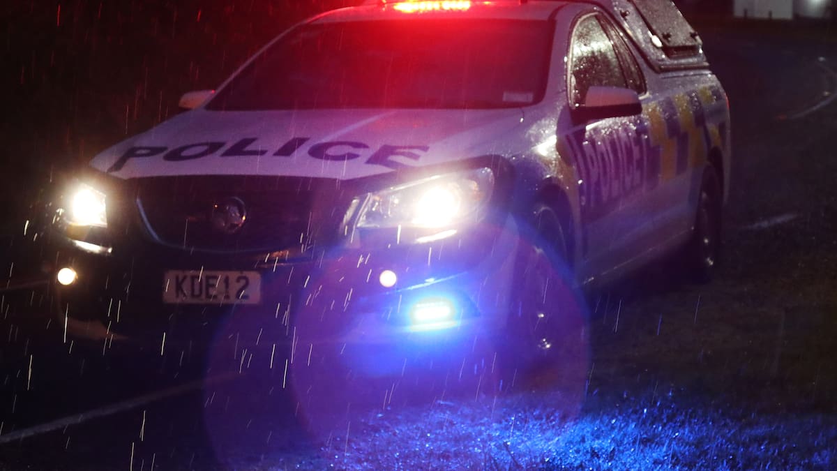 Car drives into floodwaters after heavy rain opens hole in road