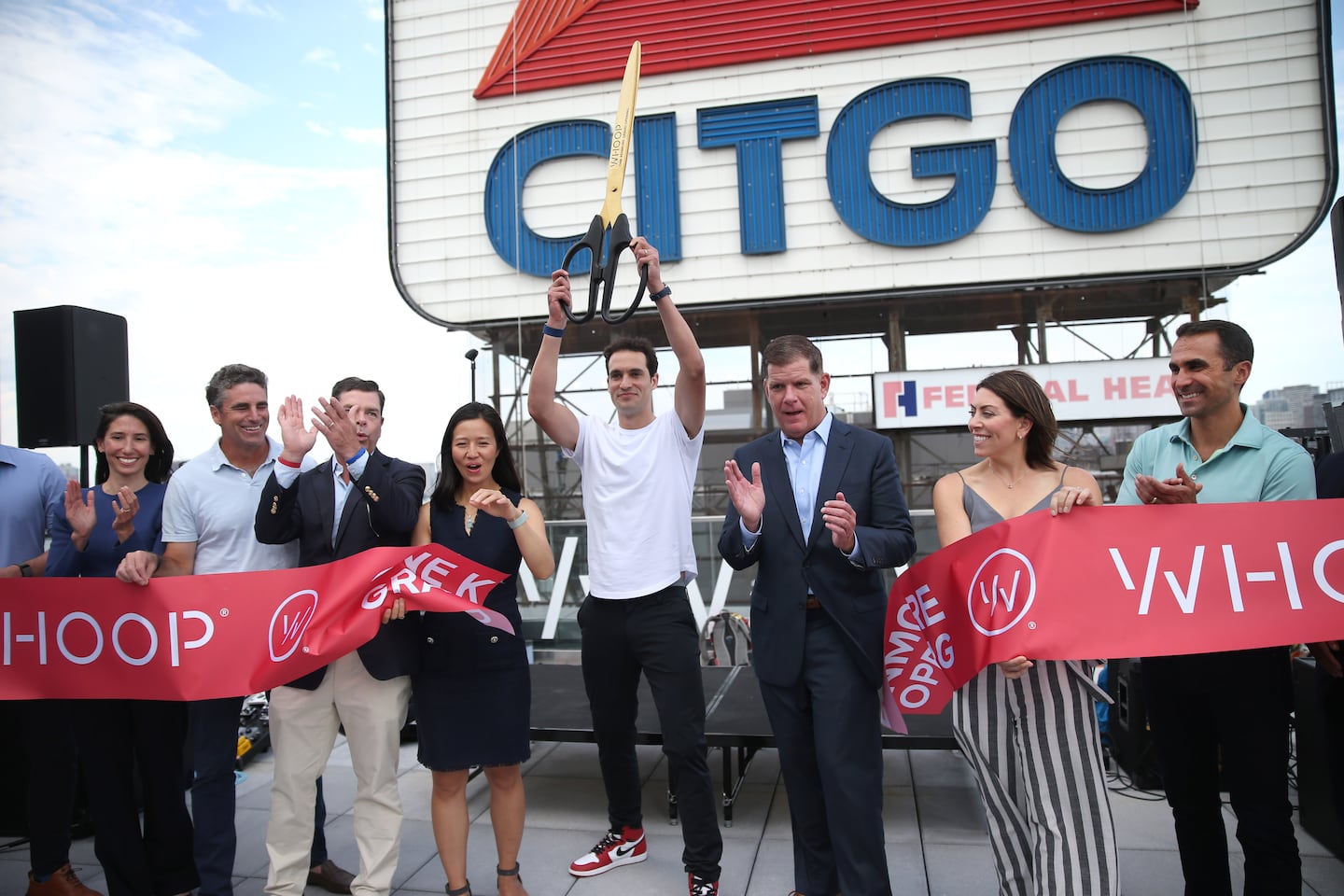 Whoop founder and CEO Will Ahmed (middle) at the opening of the new global headquarters for Whoop. Boston Mayor Michelle Wu and former Mayor Marty Walsh were on hand. Now the company has raised $575 million in a deal valuing Whoop at $10 billion.