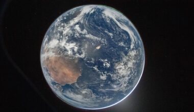 A view of Earth from Artemis II with the northern and south lights at each pole