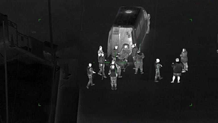 A man has been rescued close to death after clinging to a kayak in frigid water for hours off Auckland's coast, police say.