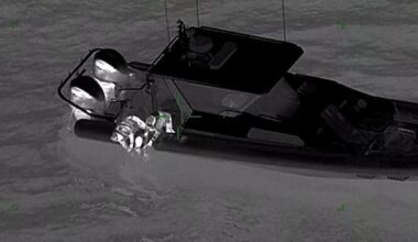 Man rescued after clinging to kayak in harbour for hours