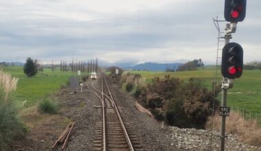 Freight train blew past stop signals towards rail truck on tracks
