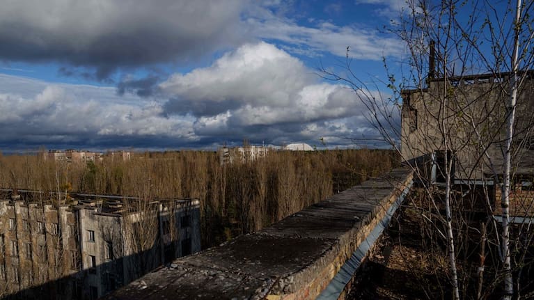 Abandoned houses are seen overgrown with vegetation at the Chernobyl exclusion zone in Prypiat, Ukraine, Monday, April 6, 2026. Chornobyl is the Ukrainian name for the city.