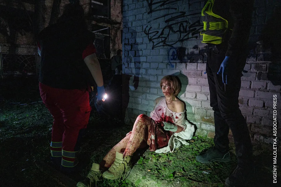 Valeria Syniuk (65) sits near her badly damaged home. She was asleep when a Russian missile destroyed the building opposite hers. Kyiv, Ukraine, 24 April 2025.