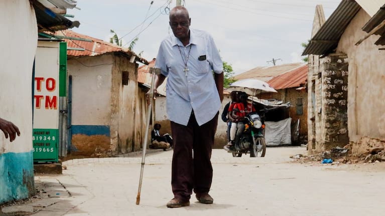 Alfred Ogulo Mulo, a village elder, walks along a street in Mikindani, Mombasa County, Kenya, on April 10, 2026.
