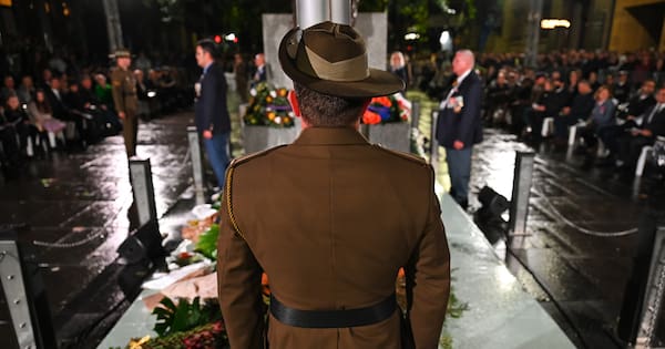 Man arrested after booing at Australian Anzac service