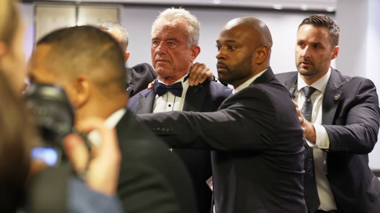 Security rapidly escort Secretary of Health and Human Services Robert F. Kennedy, Jr. out during the White House Correspondents Dinner