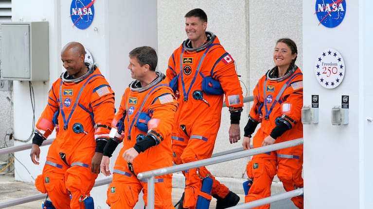 Astronauts leave the Operations and Checkout Building for a trip to Launch Pad 39-B and a planned liftoff on NASA's Artemis II moon rocket at the Kennedy Space Center. 