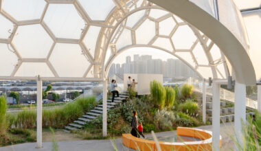 clustered canopies dot this rooftop park atop reworked warehouses