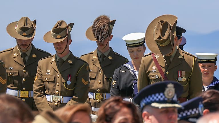 Australian and New Zealand soldiers pay their respects.