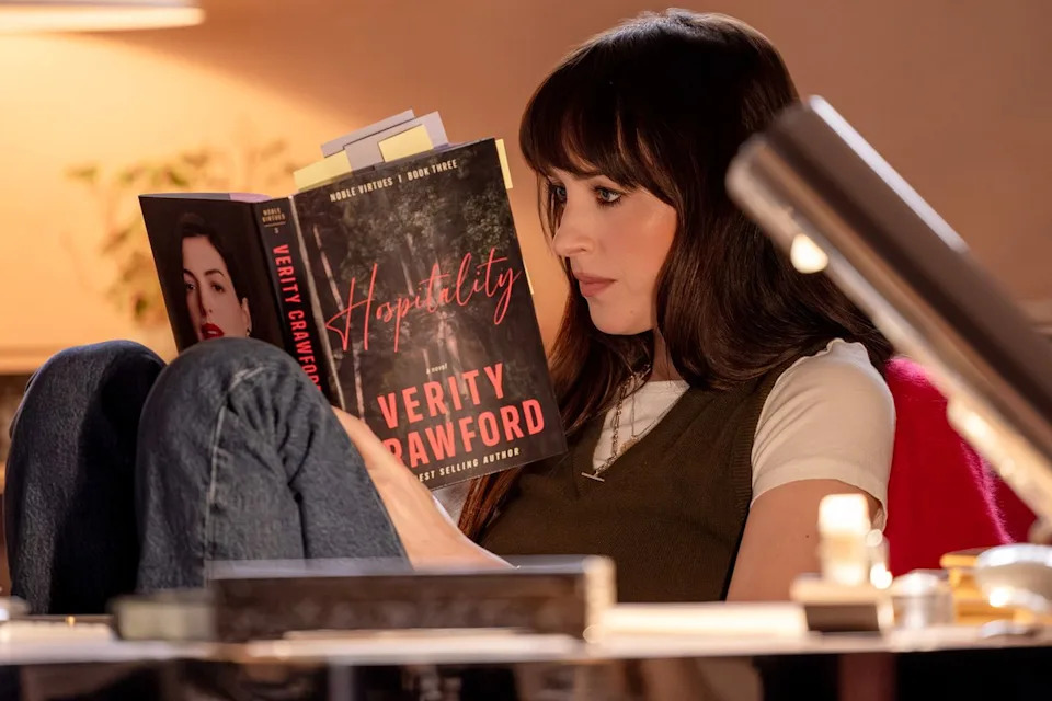 Dakota Johnson's Lowen reading a Verity Crawford novel in 'Verity'Credit: Alisha Wetherill/Amazon MGM Studios