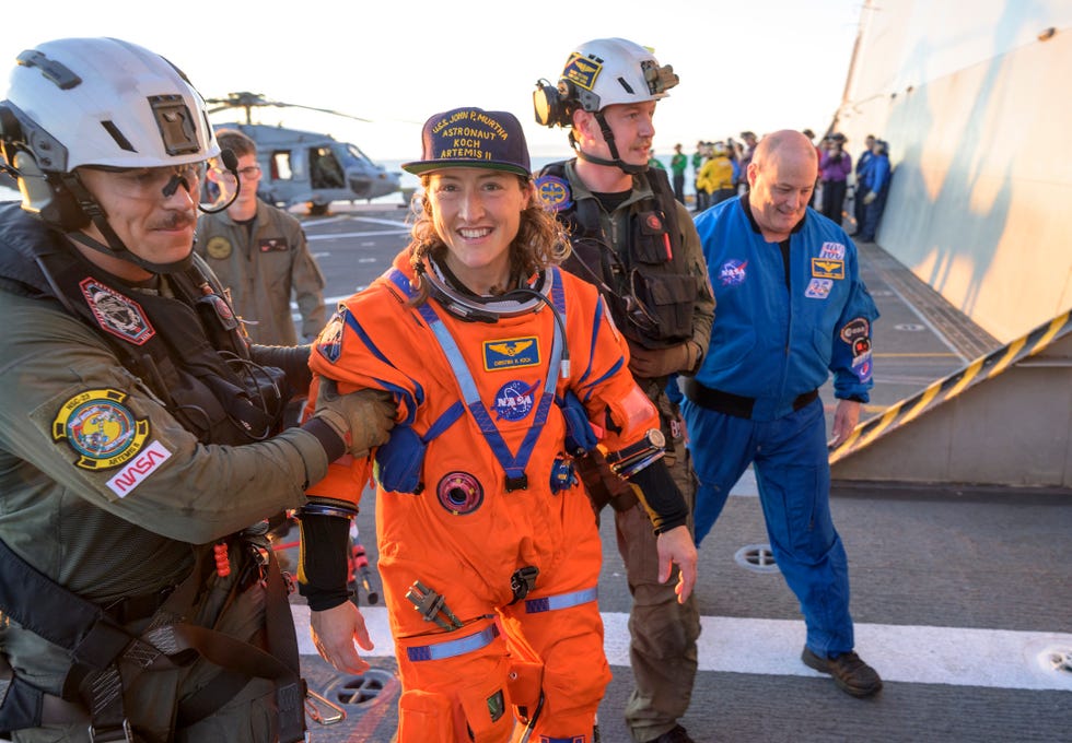 Artemis II Recovery nasa astronaut christina koch, artemis ii mission specialist is assisted off the flight deck after arriving aboard uss john p murtha after she and fellow crewmates nasa astronauts reid wiseman, commander victor glover, pilot and csa canadian space agency astronaut jeremy hansen, mission specialist were extracted from their orion spacecraft after splashdown, friday, april 10, 2026, in the pacific ocean off the coast of california nasa’s artemis ii mission took the quartet on a 10 day journey around the moon and back to earth following a splashdown at , nasa and us military teams are working to bring the crewmembers and orion spacecraft aboard the recovery ship photo credit nasabill ingalls