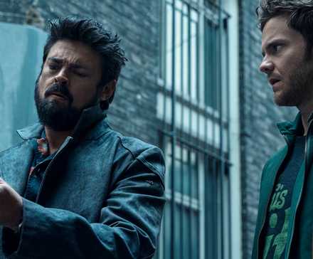 Billy Butcher (Karl Urban) with Temp V next to a concerned Hughie (Jack Quaid) in The Boys season 3