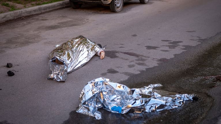 Bodies of victims are seen at the site where a gunman killed at least six people in the streets before being shot dead by police, in Kyiv, Ukraine, Saturday, April 18, 2026.