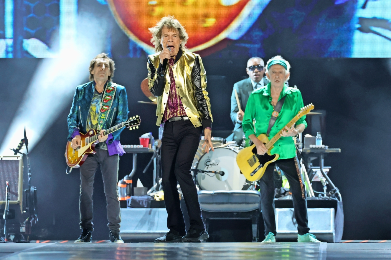 Ronnie Wood, Mick Jagger, Steve Jordan, and Keith Richards of The Rolling Stones performing on stage.