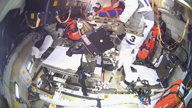 Astronauts inside the Orion crew capsule