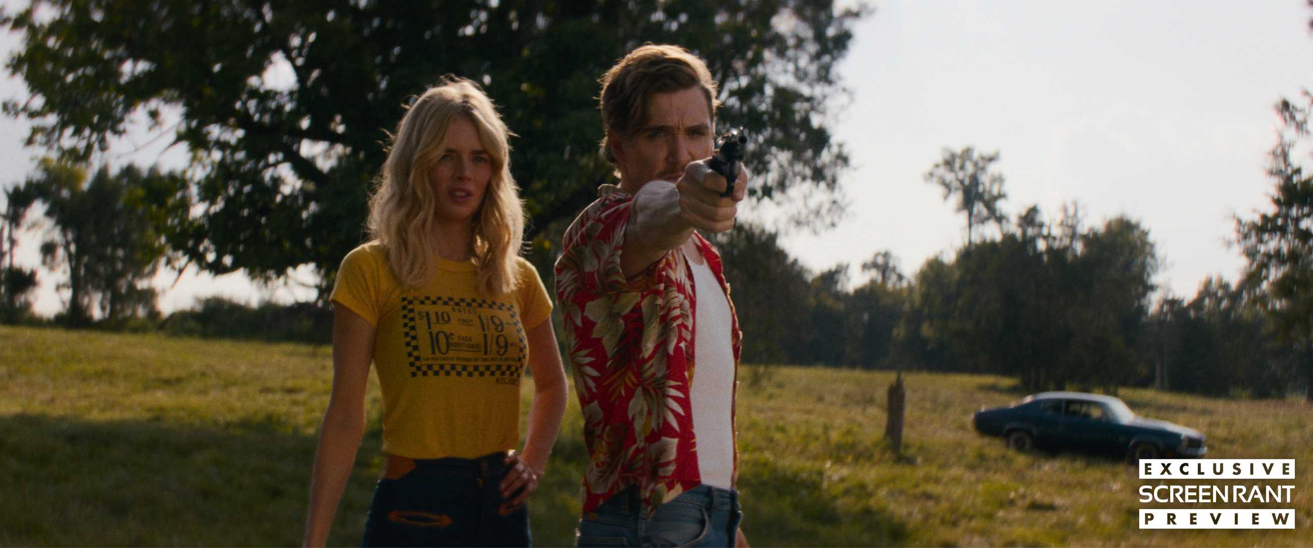 Oliver aiming his gun with Caroline next to him in Carolina Caroline