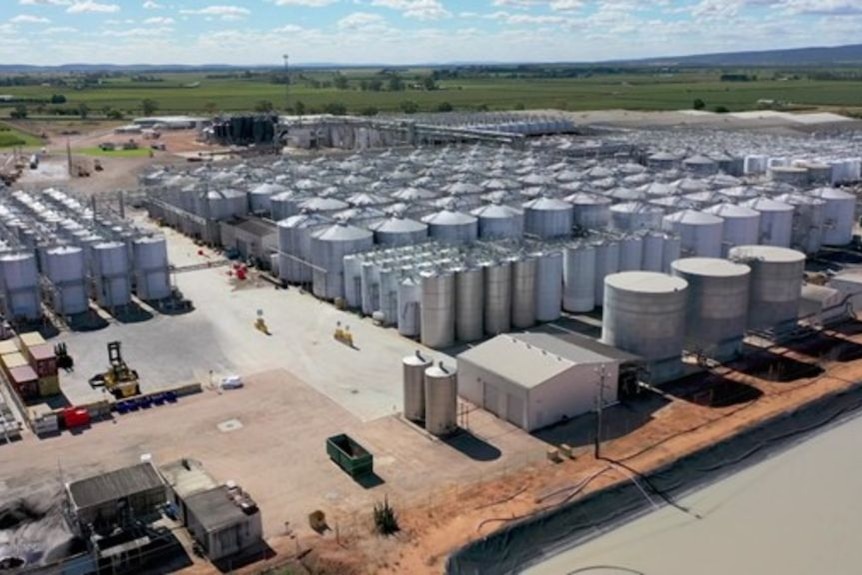 an areial image of industrial building and wine tanks