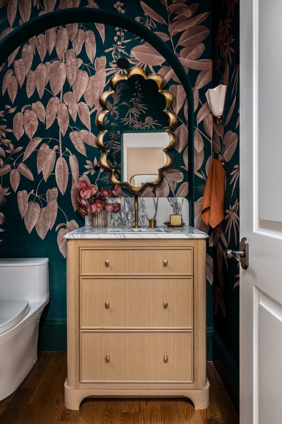 Bathroom vanity with decorative wall.