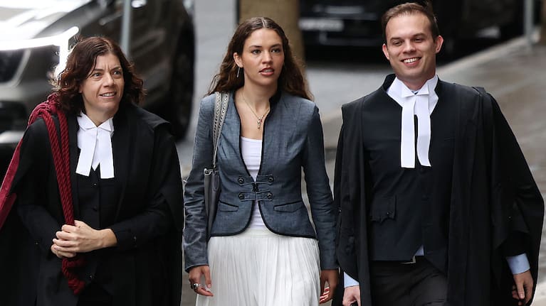 Charlotte MacInnes (C) arrives at Federal Court in Sydney