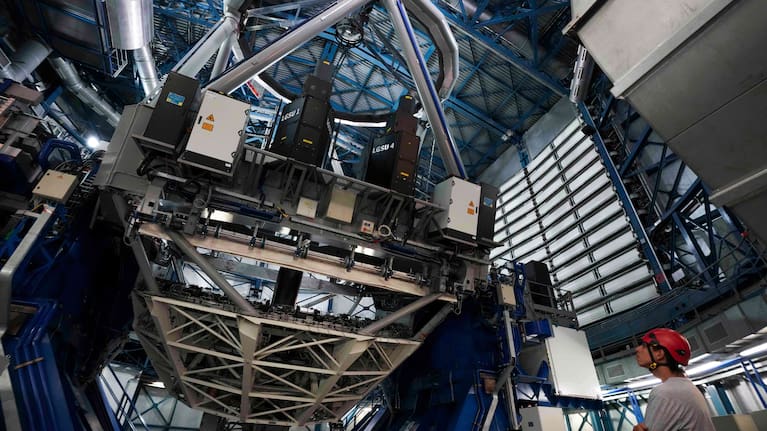 An operator looks at a Very Large Telescope at the Paranal Observatory operated by the European Southern Observatory in the Atacama Desert