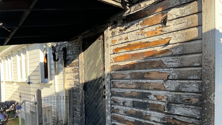 Fire damage at an entrance to the church.