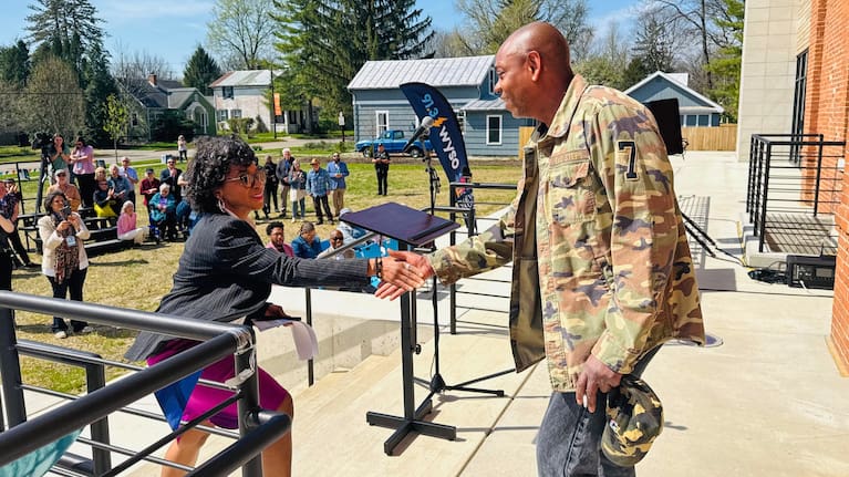 Comedian Dave Chappelle, right, shakes hands with Dayton Mayor Shenise Turner-Sloss at a ribbon-cutting ceremony for a new studio for WYSO Public Radio in Yellow Springs, Ohio, on April 9, 2026.