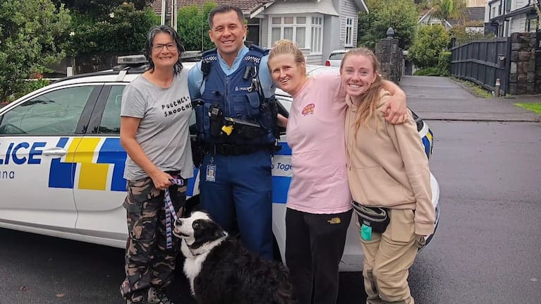 Constable Sian Toelau reunites Otis with his dog walkers.