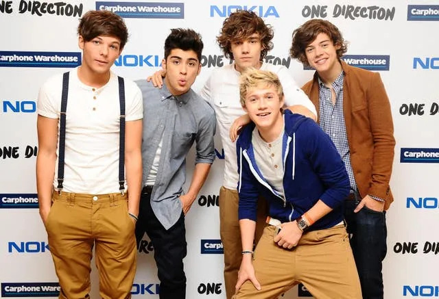 One Direction pose for the cameras