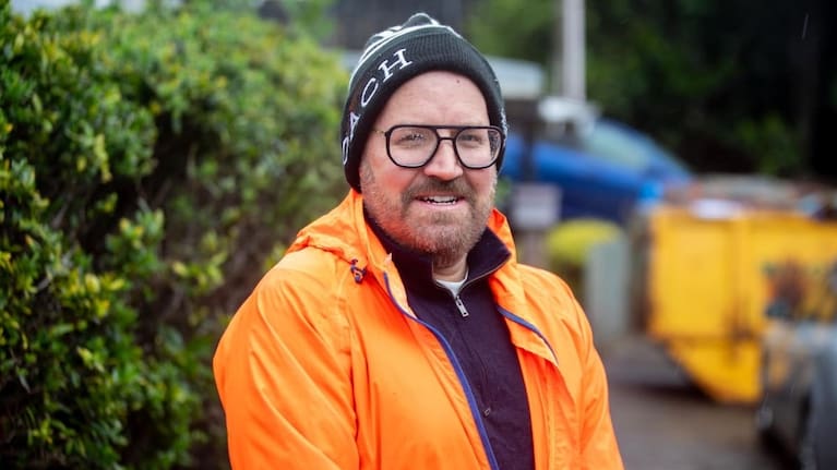 David Fraser found his car perched on a fence after flash flooding in Wellington.