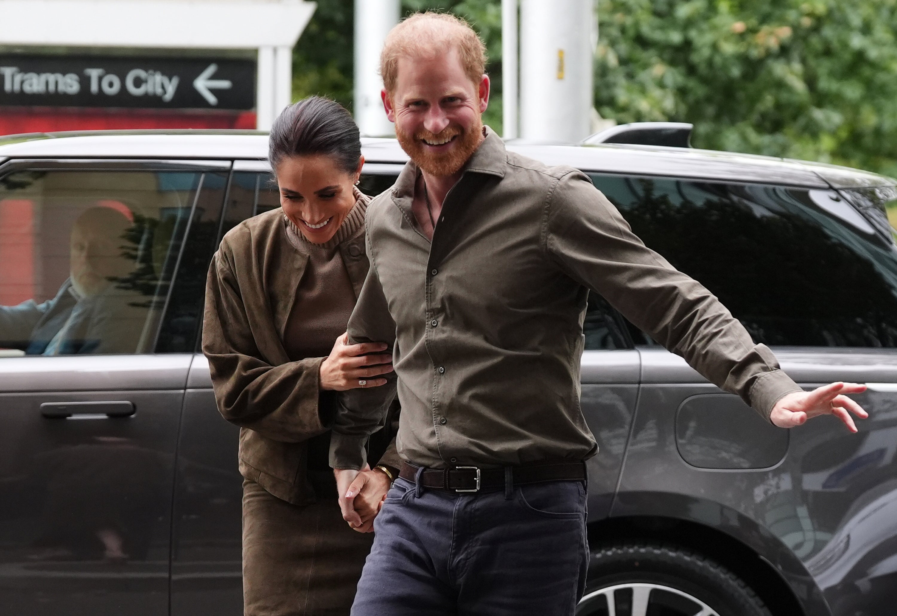 Having the time of their lives: Prince Harry and Meghan in Australia – without their children